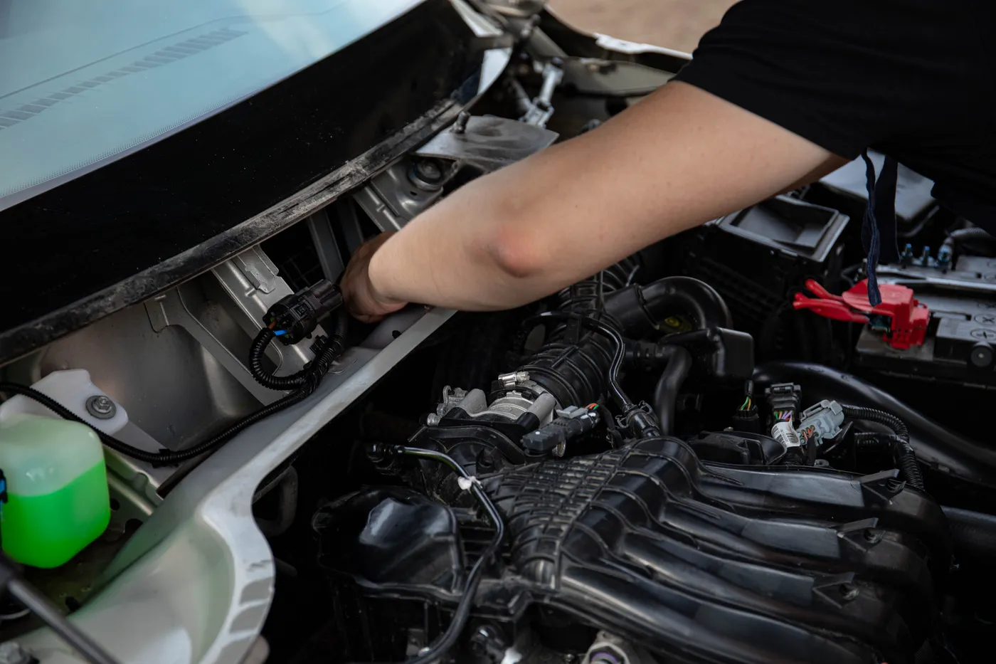 Mechanic working in an engine bay